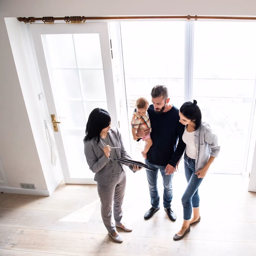 buyers and realtor buying a house.